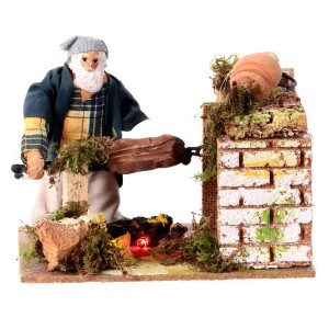 (84053) Mężczyzna przy ognisku z pieczonym prosiakiem, RUCHOMA FIGURA na 220V, do figur o wys. 8-10cm